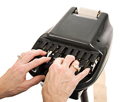 person typing on a shorthand machine