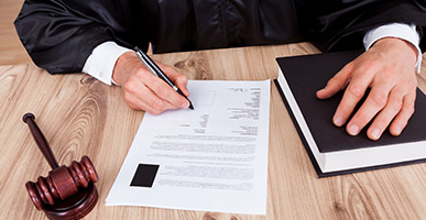 Judge signing document