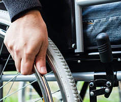 Man pushing wheelchair