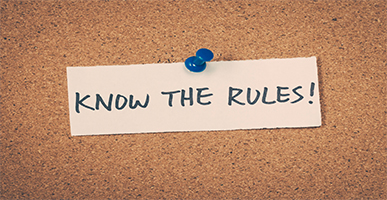 Cork board with post-it that says Know the Rules