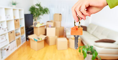 keys to a house, moving boxes in background