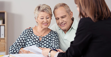 Couple getting assistance from staff person