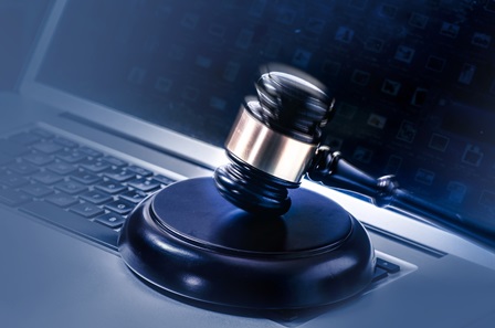 image of a gavel on a laptop keyboard