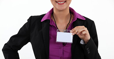 Woman holding a visitor badge