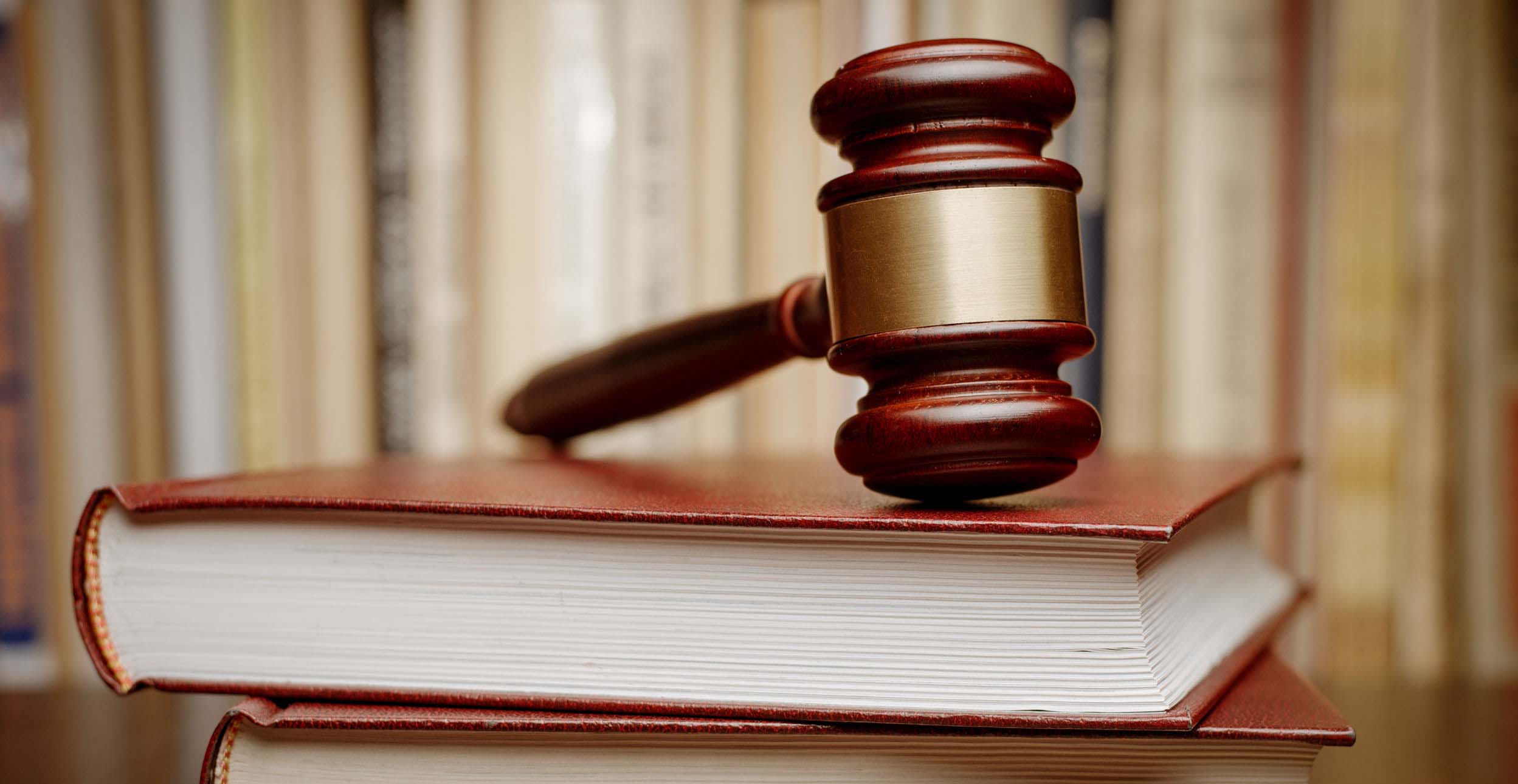 Judge gavel sitting atop a book
